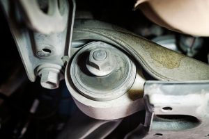 Front suspension control arm bushing on a car